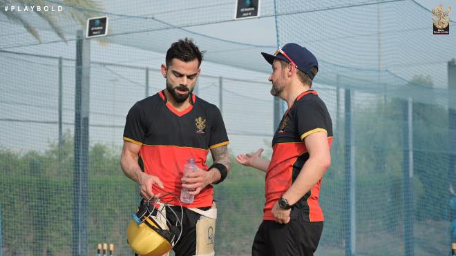 RCB skipper Virat Kohli and director Mike Hesson interacting during training session