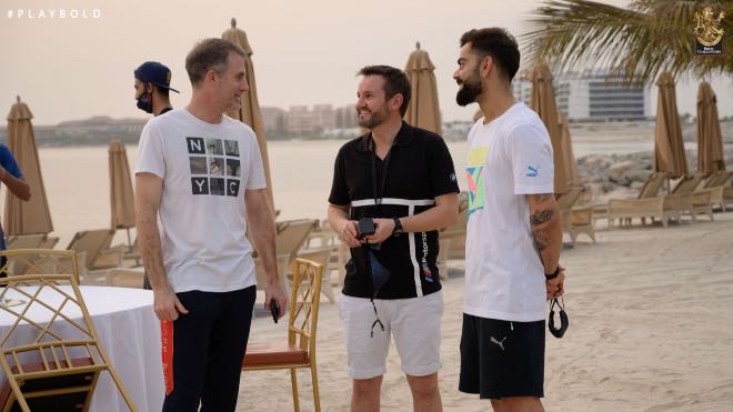 RCB skipper Virat Kohli, head coach Simon Katich and director of cricket Mike Hesson interact with each other